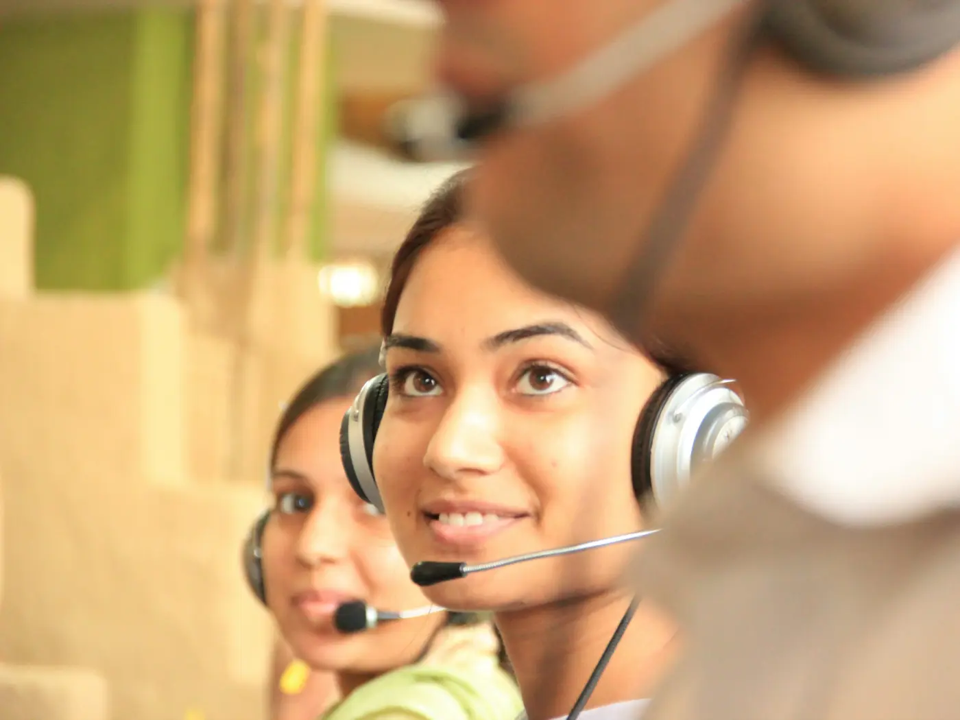 Assistance coordinators with headsets in an operations room